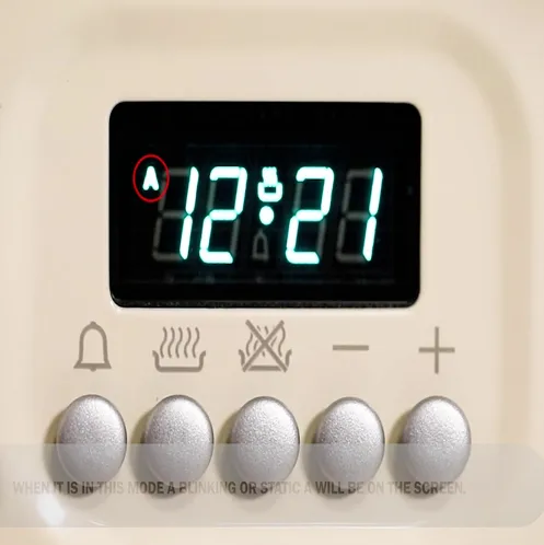 Automatic cooker clock showing A in display